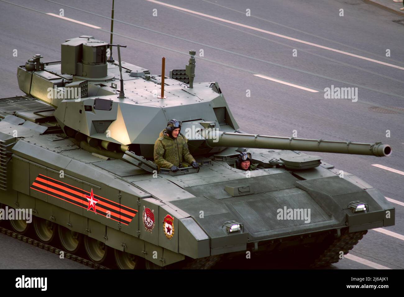 Russian T-14 Armata Main Battle Tank (MBT) with commander and driver looking out at  Victory Parade in Moscow Stock Photo