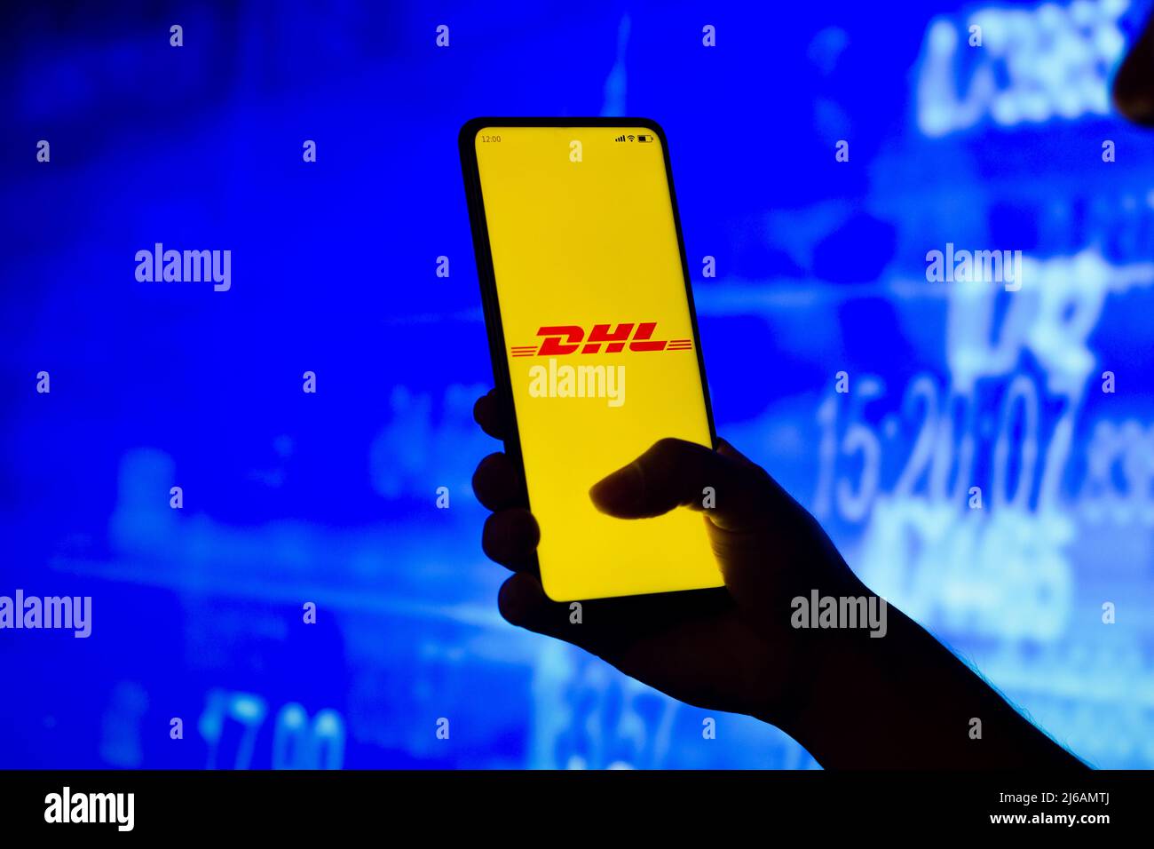 In this photo illustration, a silhouetted woman holds a smartphone with ...