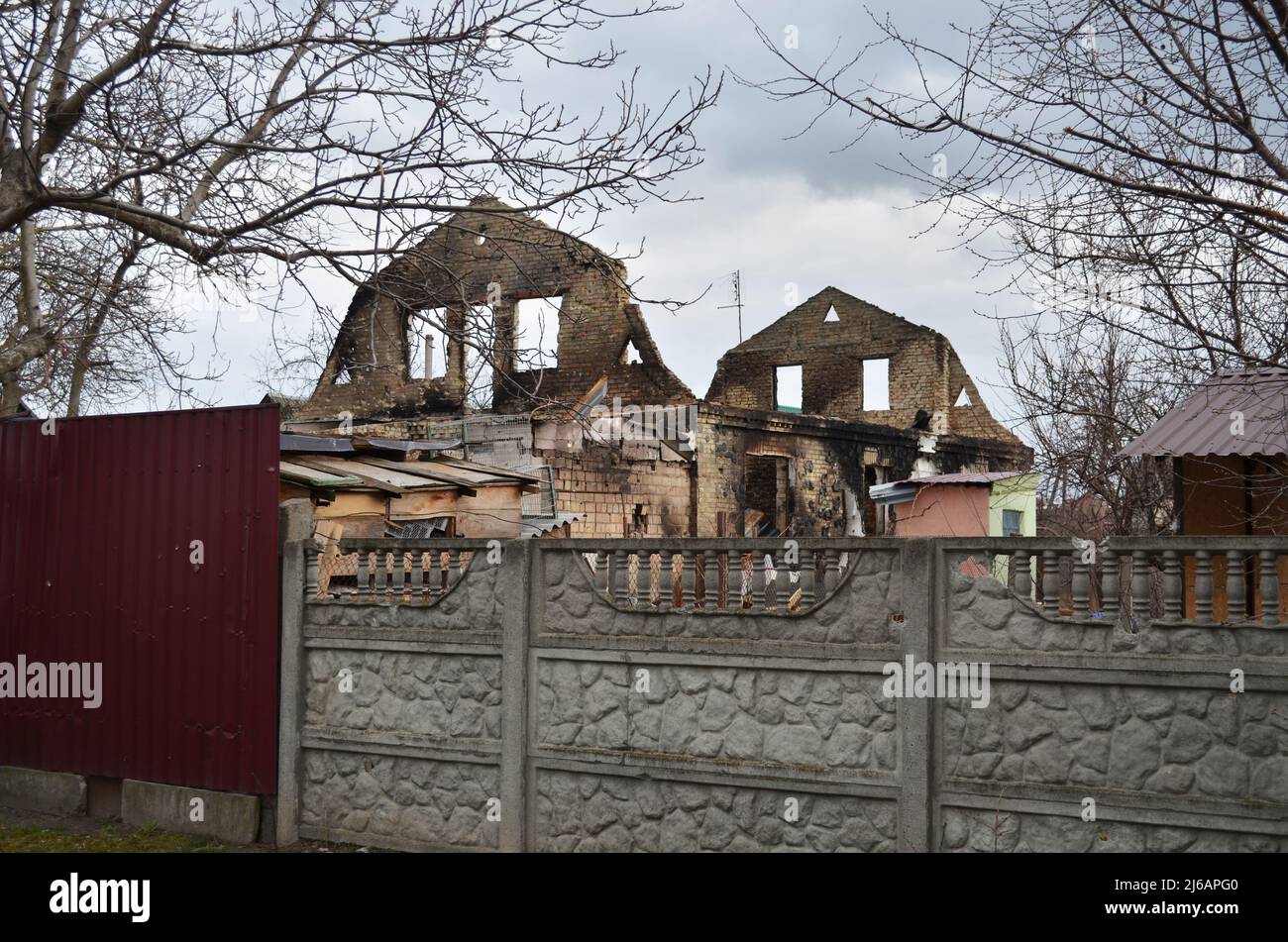 Myla, Kyiv region, Ukraine - April 11, 2022: Destroyed private house in Myla village near Zhytomyr highway during the Russian invasion of Ukraine. Stock Photo