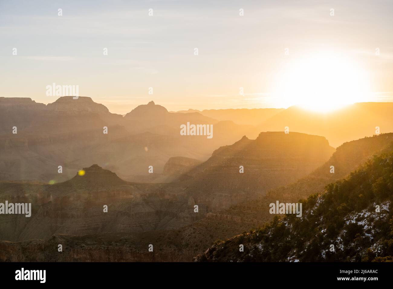 Bright Sun Over the Edge of the Grand Canyon at Sunrise along the South ...