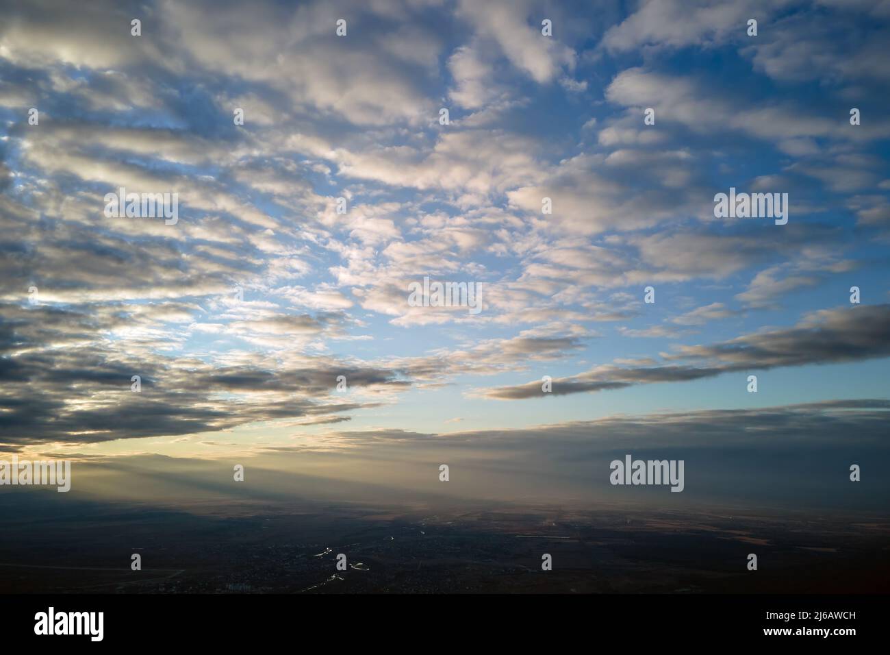 Aerial view at high altitude of dense puffy cumulus clouds forming ...