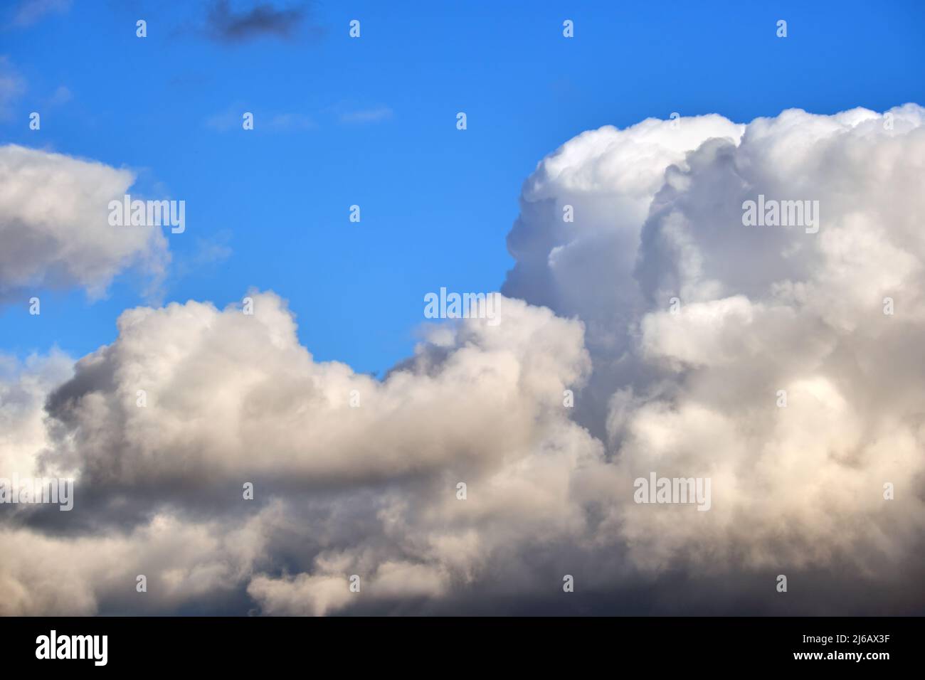 Bright landscape of white puffy cumulus clouds on blue clear sky Stock ...