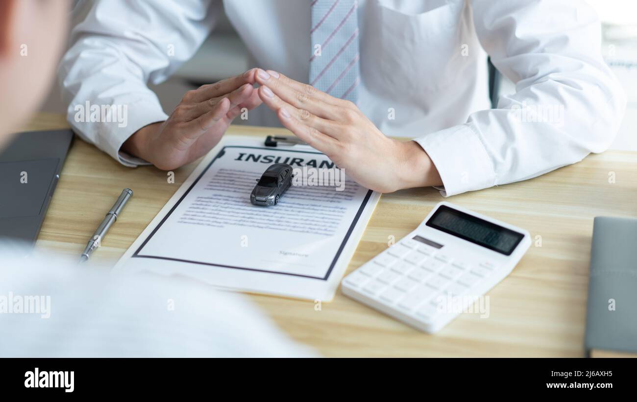 Insurance concept the car merchant presenting the function and