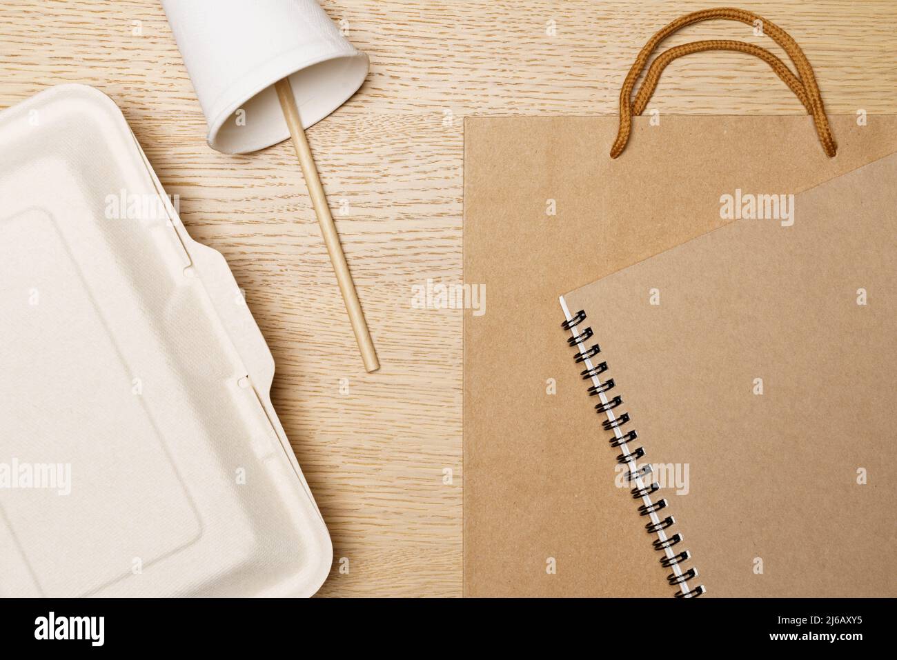 Eco friendly concept, Food box paper cup paper bag and notebook made from natural fiber. Stock Photo