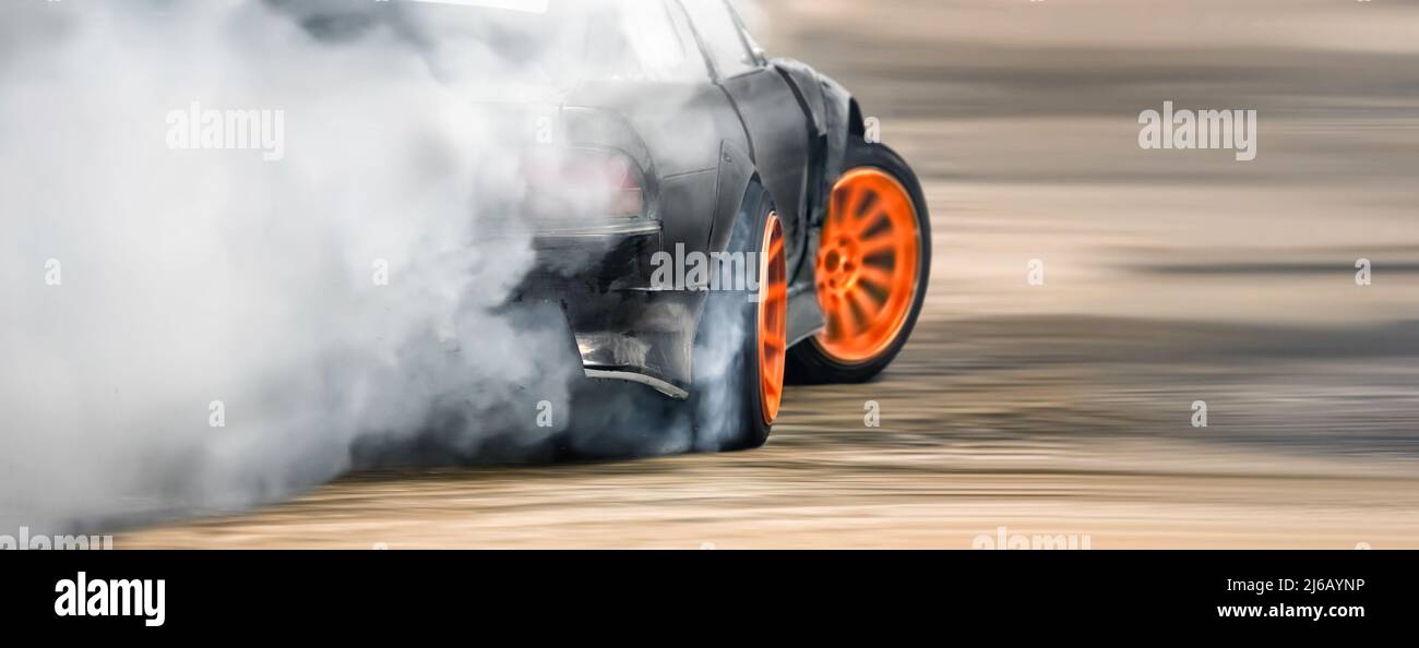 Race drift car burning tires on speed track Stock Photo Alamy