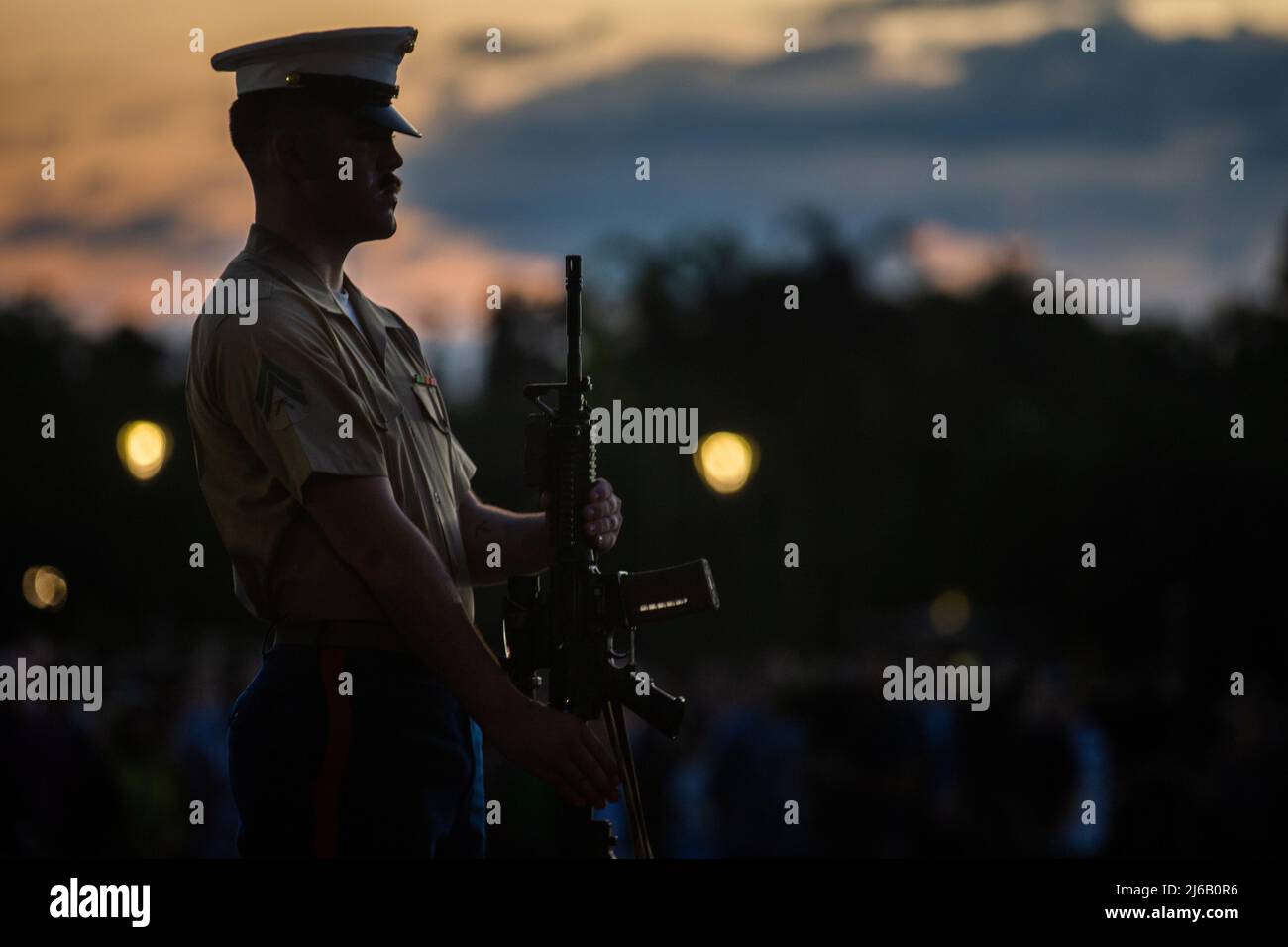 Apr 24, 2022 - Darwin, Northern Territory, Australia - U.S. Marine Corps Cpl. Zachariah Flores, an intelligence specialist with the Command Element, Marine Rotational Force-Darwin (MRF-D) 22, presents arms during the 107th Commemorative Service in honor of Australian and New Zealand Army Corps (ANZAC) Day in Darwin, NT, Australia, April 25, 2022. U.S. Marines with MRF-D 22 participated in Anzac Day ceremonies and celebrations to commemorate the first major military action fought by Australian and New Zealand forces during the First World War, and to join in recognition of the sacrifices and se Stock Photo