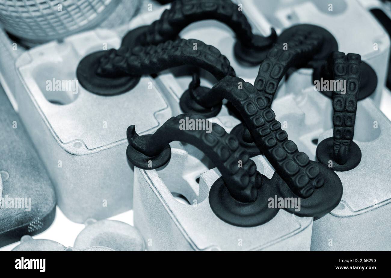 Models printed on 3D printer. Black objects printed on 3D printer made plastic Stock Photo