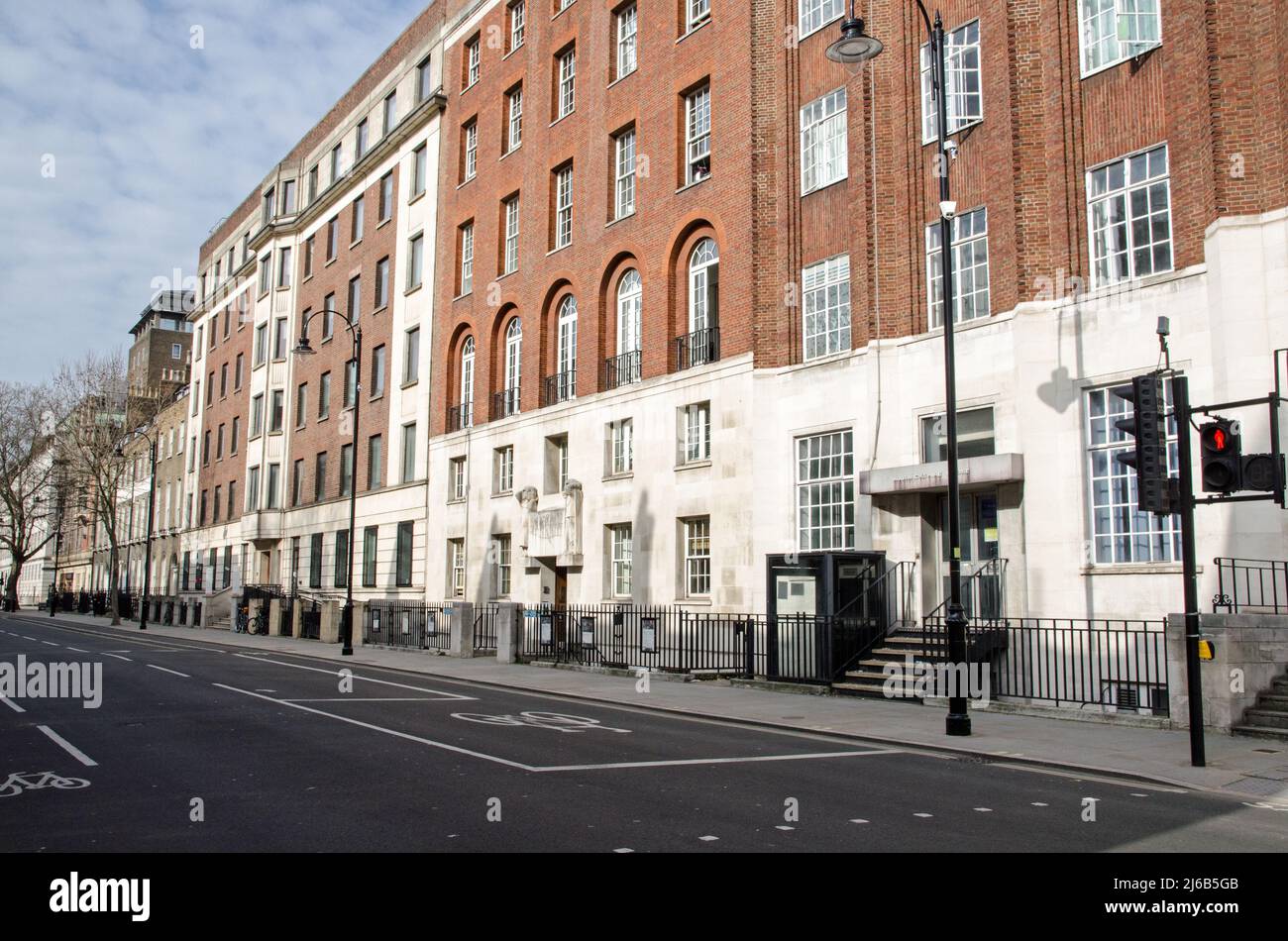 London, UK - March 21, 2022: View looking north along Gower Street in Camden, Central London wiht the headquarters of the Royal Academy of Dramatic Ar Stock Photo