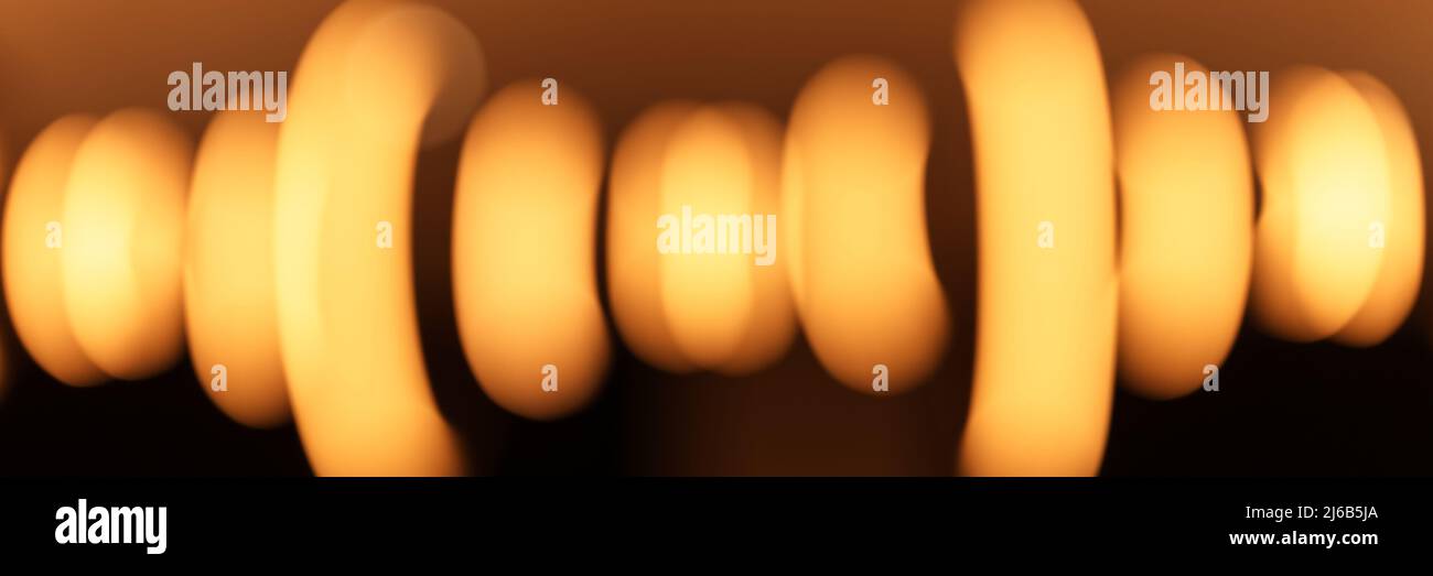 blurred hanging lamp bulb in the form of rings. blur beautiful abstract lighting under the ceiling from modern pendant electricity round lamps chandel Stock Photo