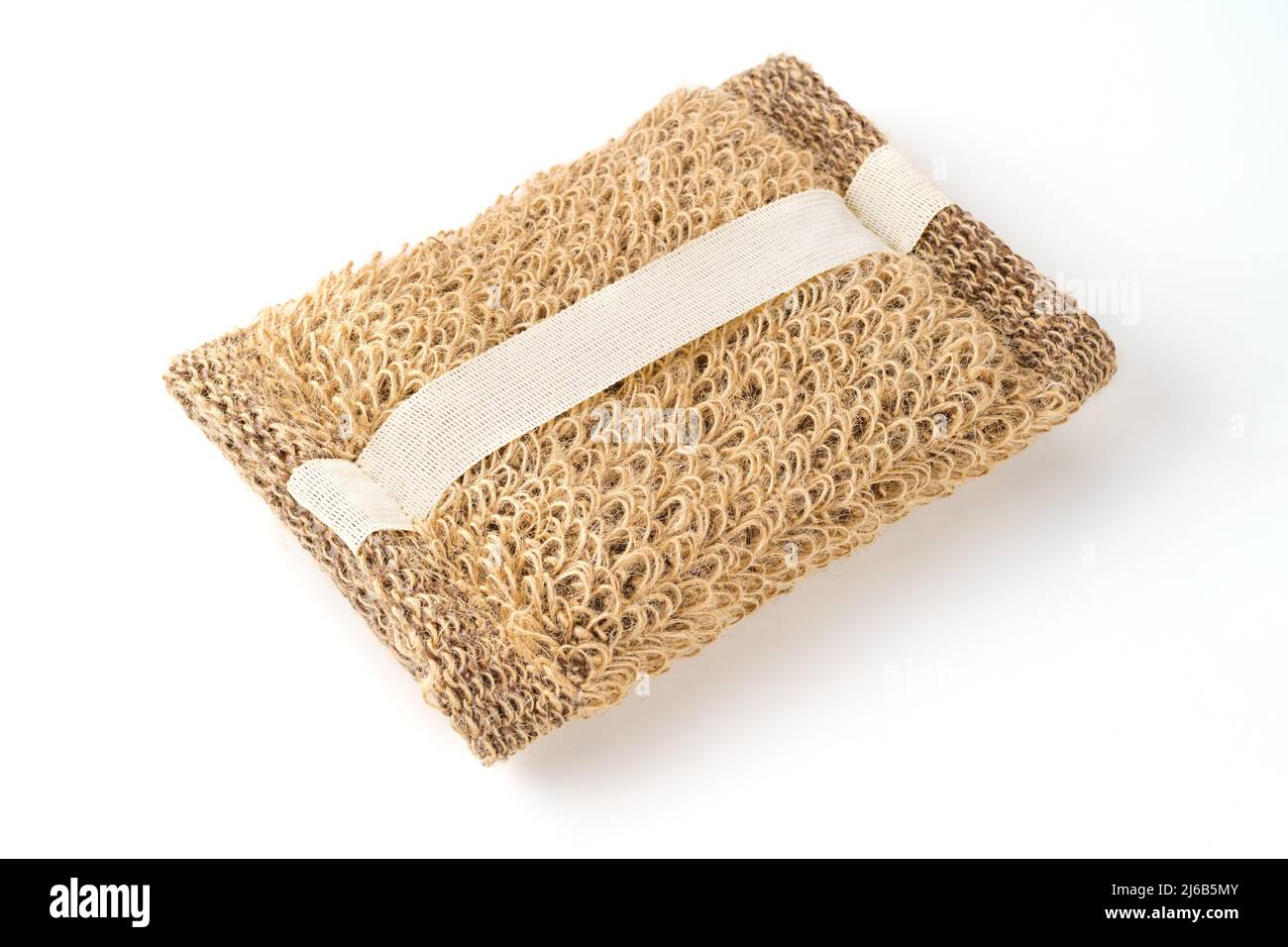 Jute brown washcloth isolated on white. Close-up of a rough brown natural washcloth Stock Photo