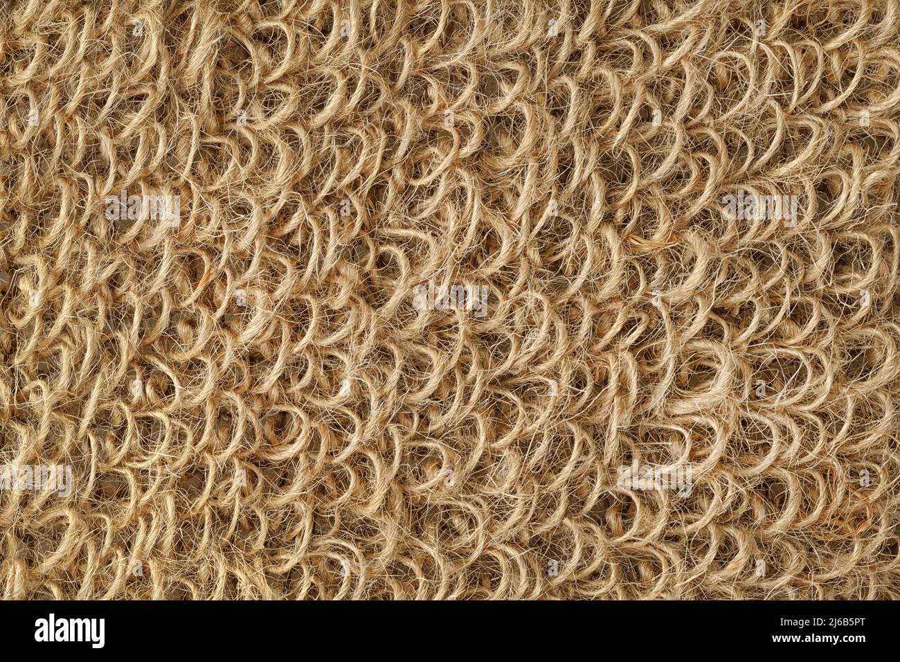 Jute washcloth extreme close up for texture and background. Textured surface made of rough rope loops Stock Photo