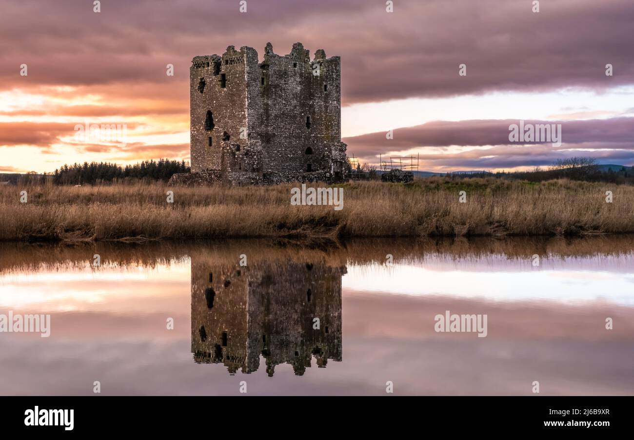 Winter sunset over Threave Castle, reflecting on the River Dee, Castle Douglas, Scotland Stock Photo
