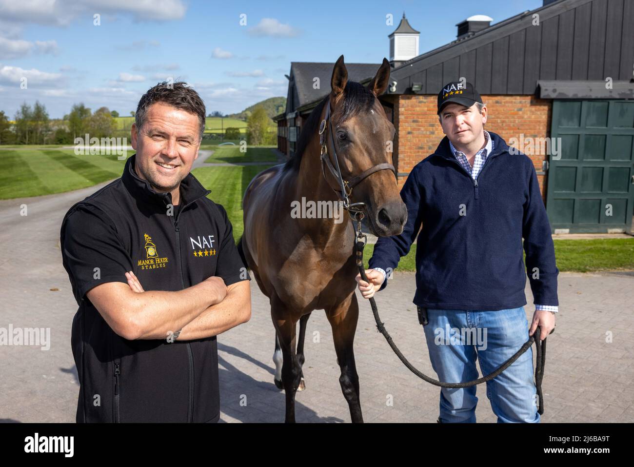Manor House Stables, Malpas, Cheshire. PIC shows Michael Owen and trainer Hugo Palmer with horse