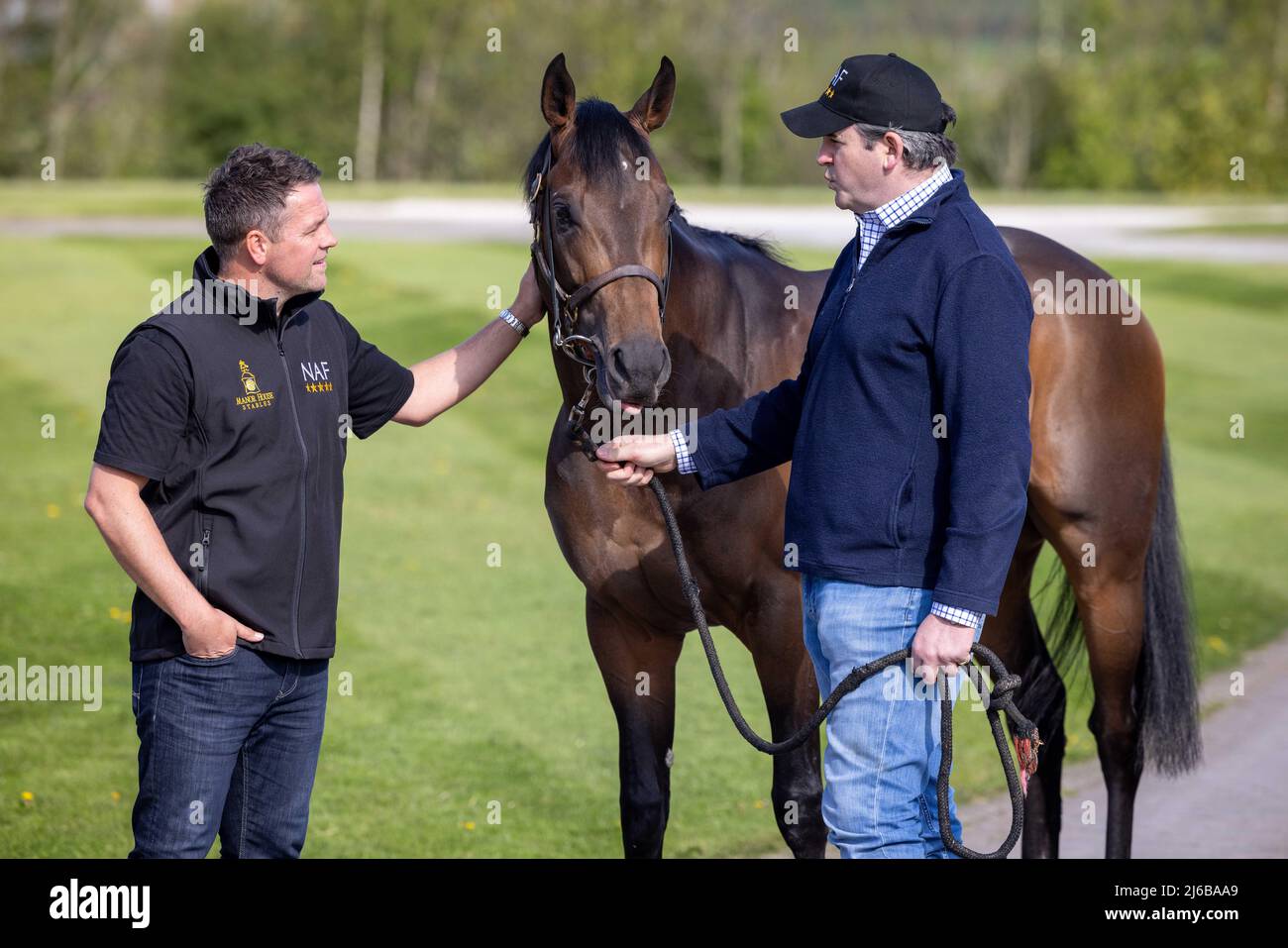 Manor House Stables, Malpas, Cheshire. PIC shows Michael Owen and trainer Hugo Palmer with horse Mr McCann. Stock Photo