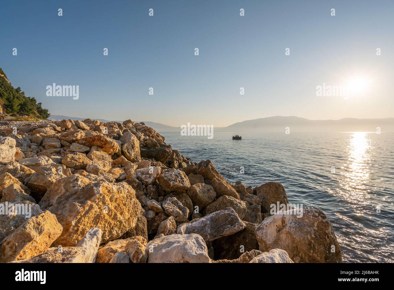 Sunset at rocky stone beach in Albania. Adriatic sea, peninsula