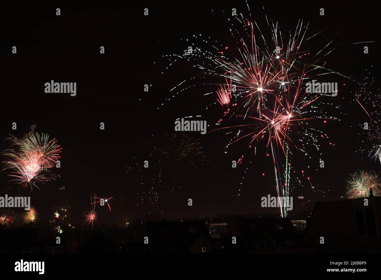 Fireworks exploding in several colors during new year Stock Photo - Alamy