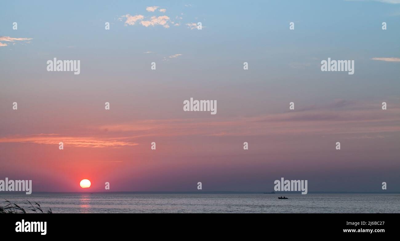 Sunset sky over Gulf of Finland, coastal summer landscape, panoramic photo Stock Photo