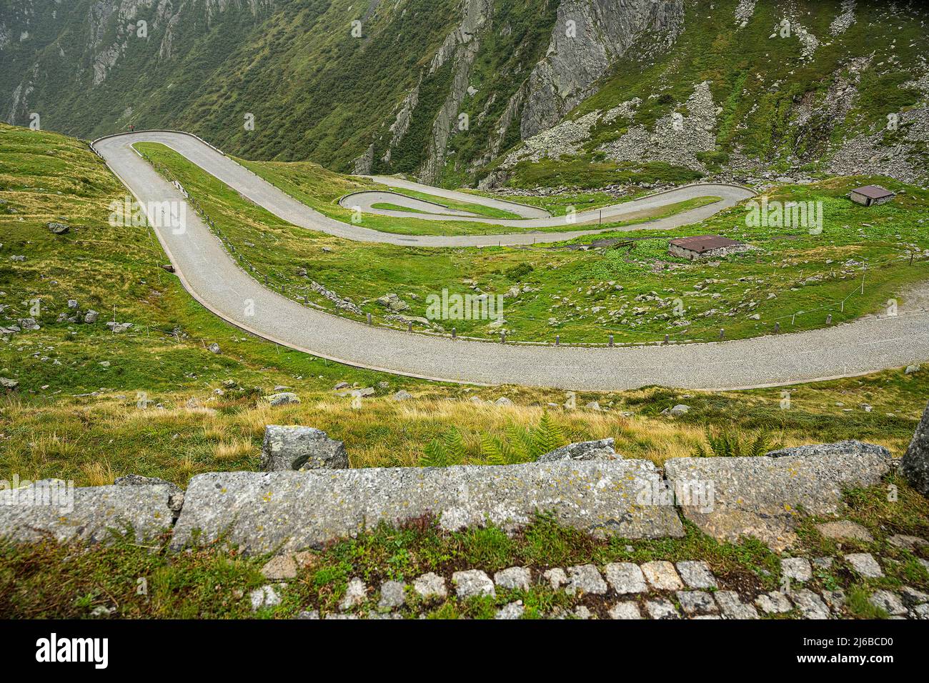Road curves on the south side of the St. Gotthard Pass, Canton Ticino, Switzerland Stock Photo