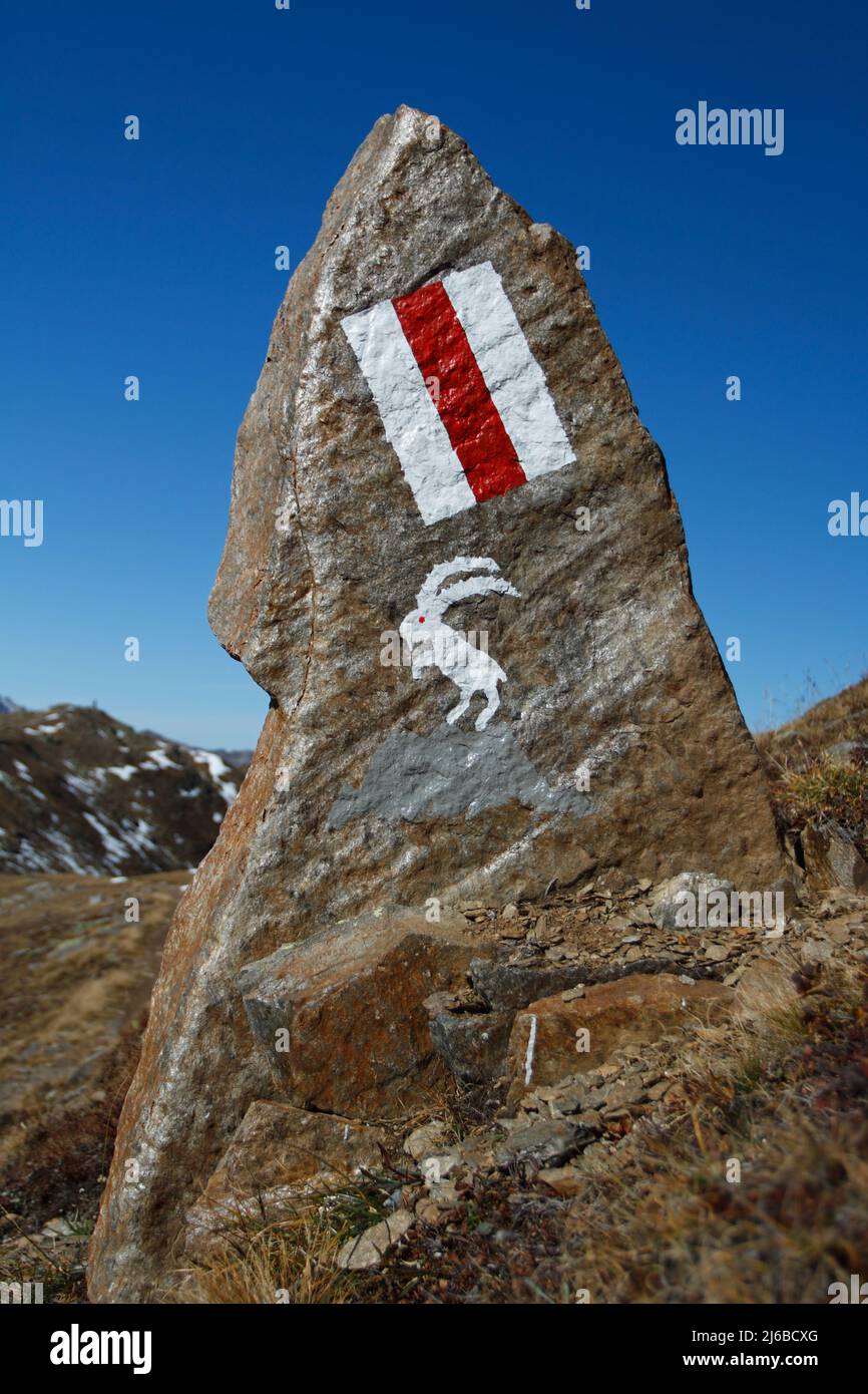 A typical white-red-white trailmark, the signal of hikings paths in Switzerland Stock Photo