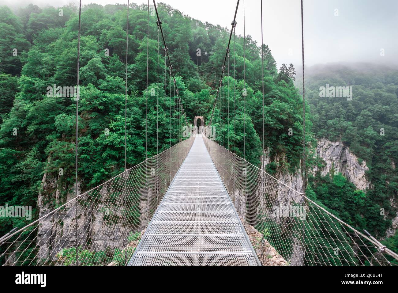 Passerelle d'Holzarte Bridge in Haute-Soule, in the French Basque Country.  It's a narrow pedestrian bridge dating from 1920, suspended 180 m. above a Stock Photo