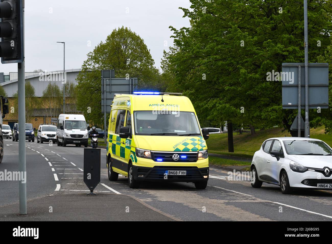 ambulance travelling along a road Stock Photo