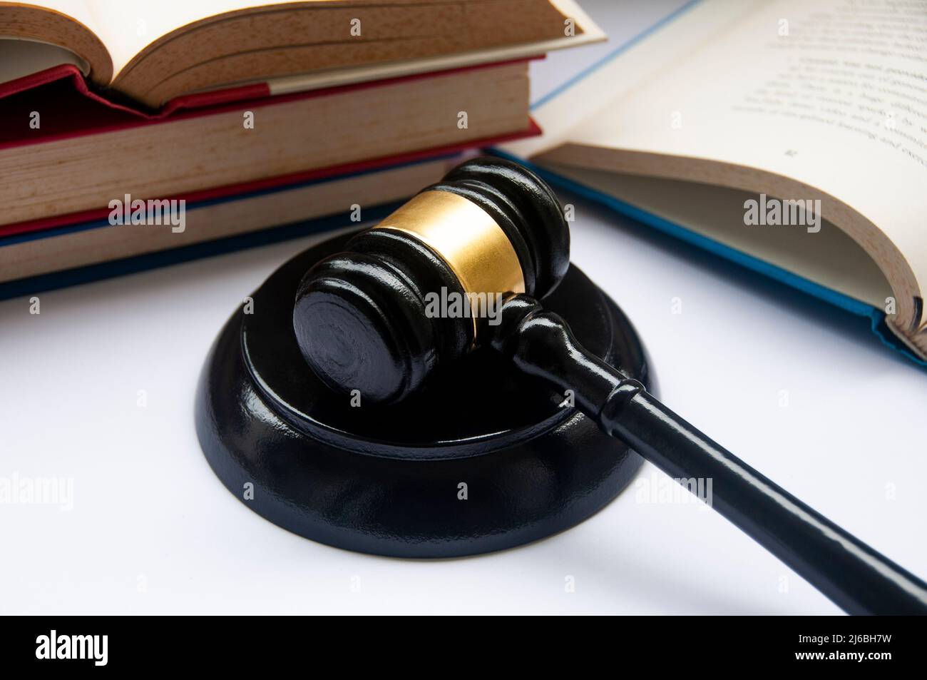 Lawyer gavel on white cover with books background. Law concept Stock Photo