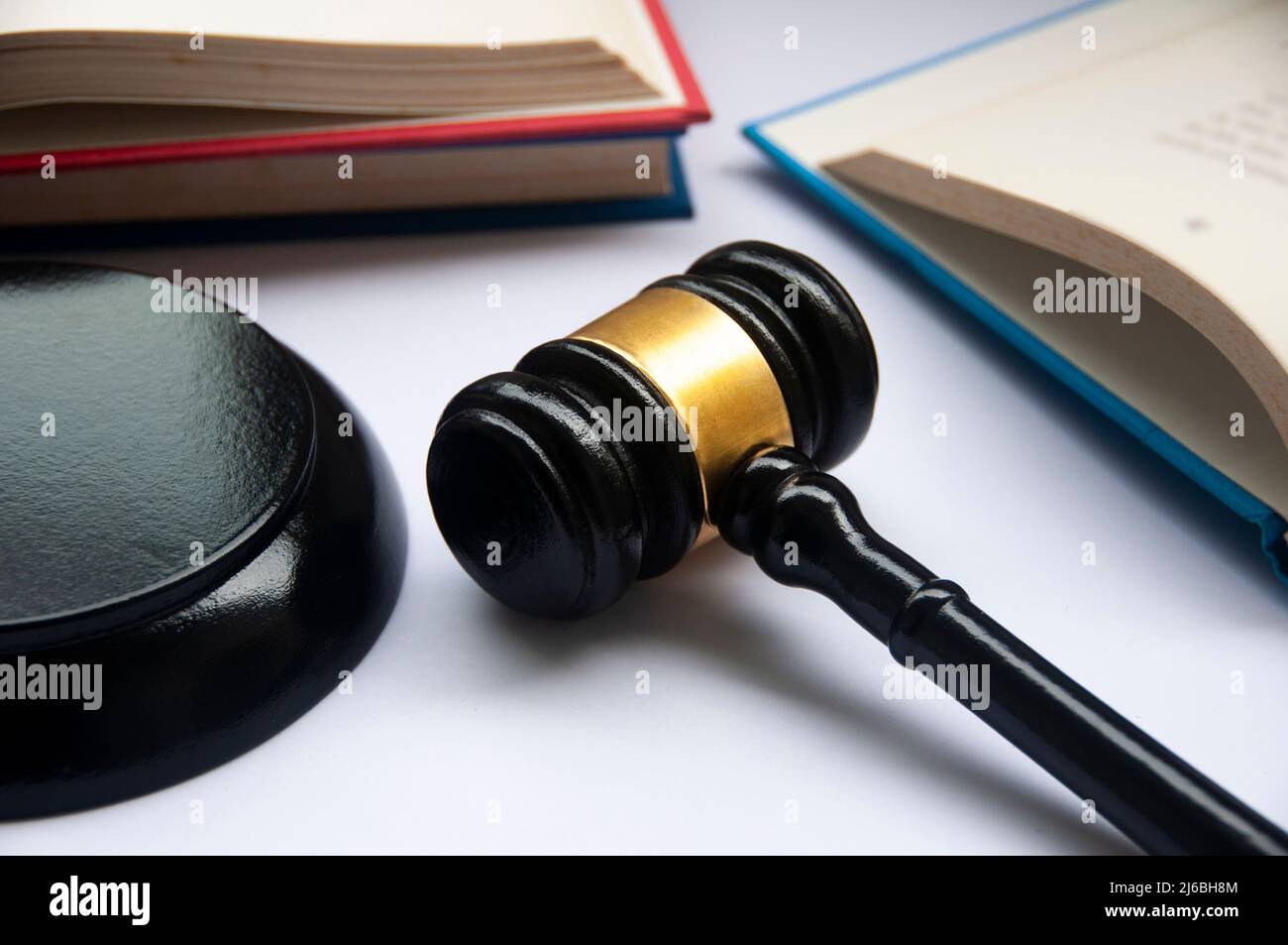 Lawyer gavel on white cover with books background. Law concept Stock Photo