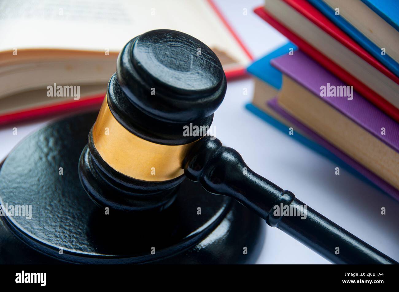 Lawyer gavel on white cover with books background. Law concept Stock Photo