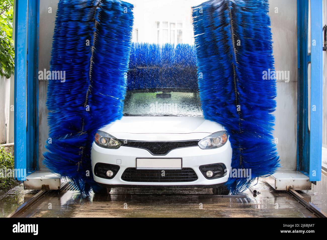 Washing the car in an automatic washing machine. Brushed Car Washing