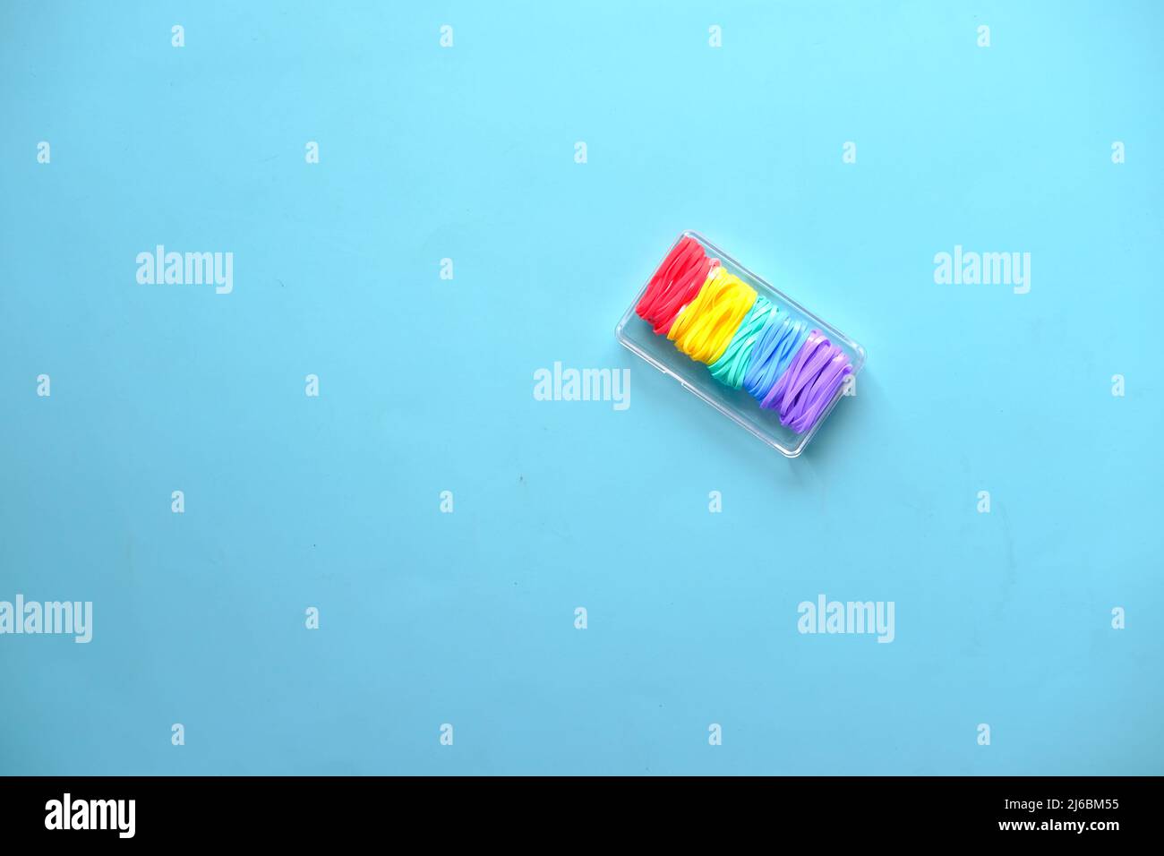 rainbow color Rubber bands on color background  Stock Photo
