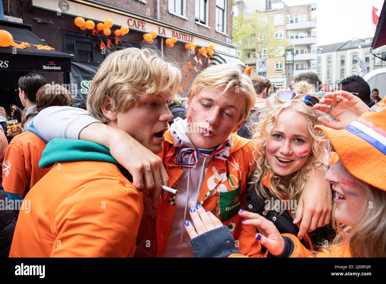 People dressed in orange clothes seen celebrating during the King's Day.  King's Day known as Koningsdag is an orange filled celebration for the  king's birthday, a national holiday full of events across