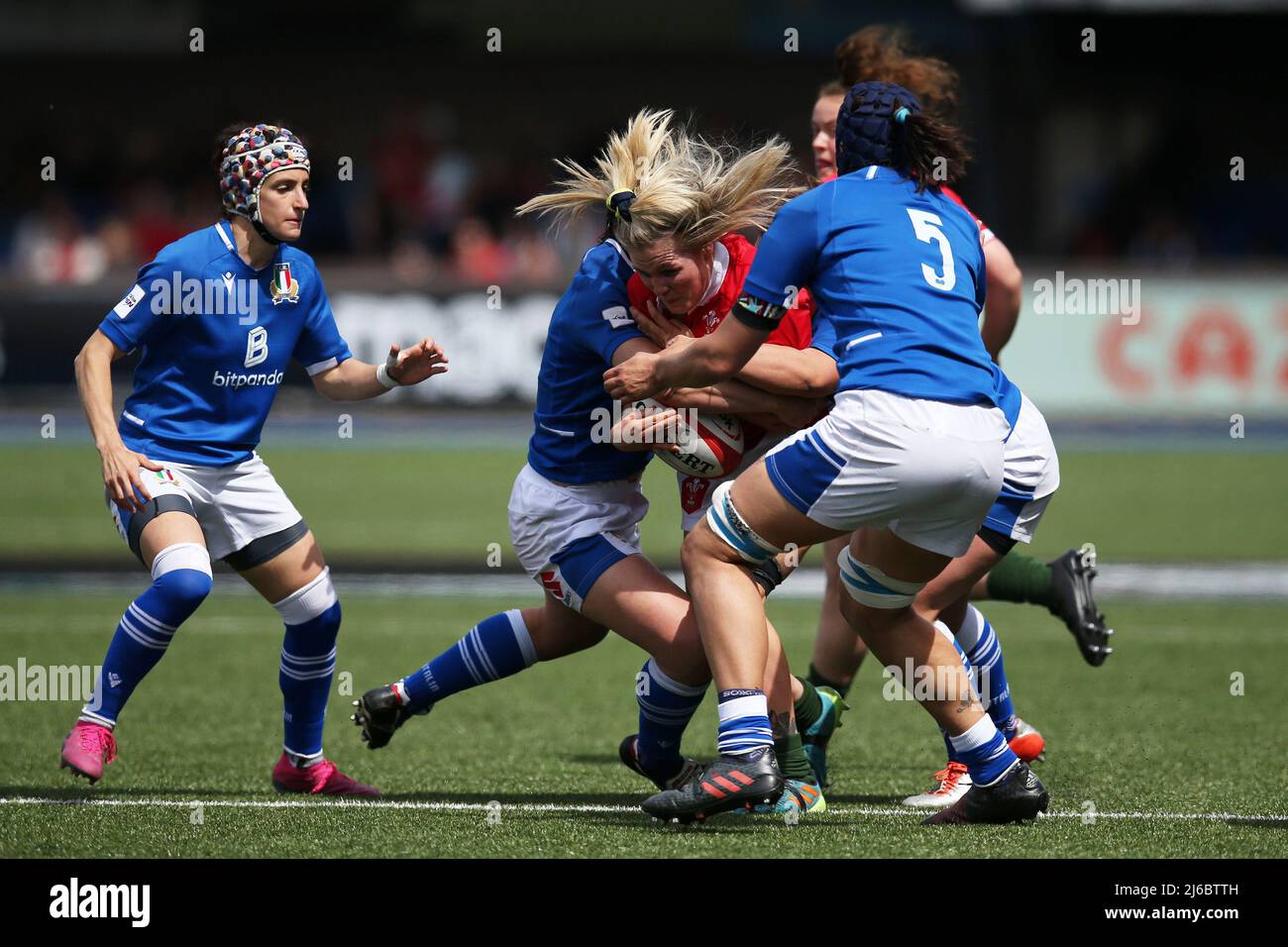 Alex Callender of Wales (c) is tackled. TikTok Women’s Six Nations 2022 championship , Wales women v Italy women at the BT Sport Arms Park in Cardiff, South Wales on Saturday 30th April 2022. pic by  Andrew Orchard/Andrew Orchard sports photography/Alamy Live news Stock Photo