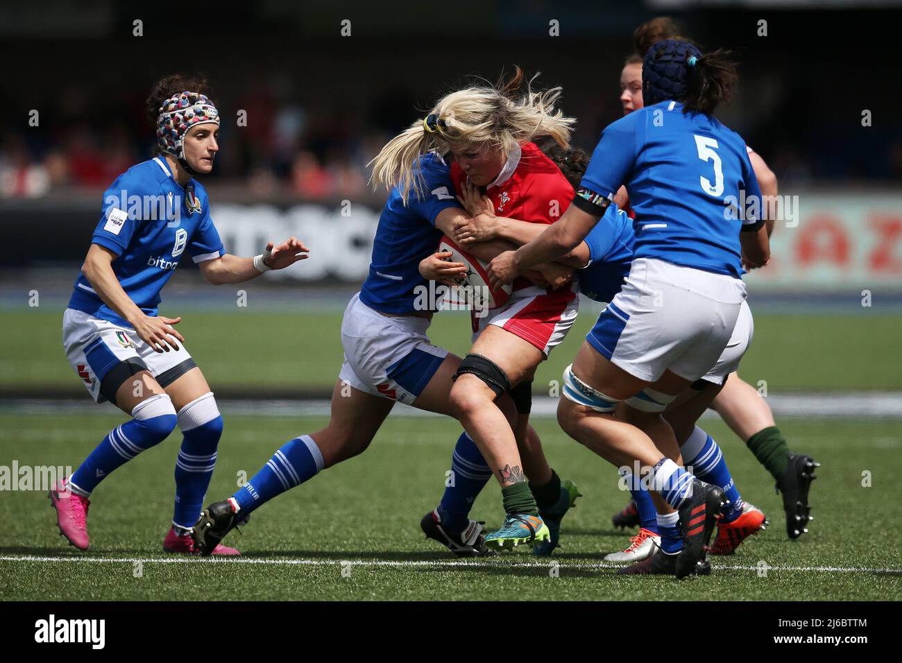 Alex Callender of Wales (c) is tackled. TikTok Women’s Six Nations 2022 championship , Wales women v Italy women at the BT Sport Arms Park in Cardiff, South Wales on Saturday 30th April 2022. pic by  Andrew Orchard/Andrew Orchard sports photography/Alamy Live news Stock Photo
