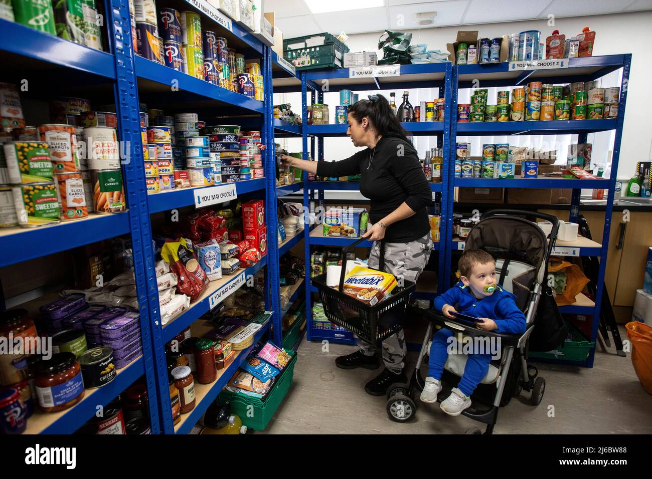 Caroline and her son Joshua at Eastmoor Community Project at St. Swithun’s Community Centre a community pantry or food bank in Wakefield , England . Stock Photo