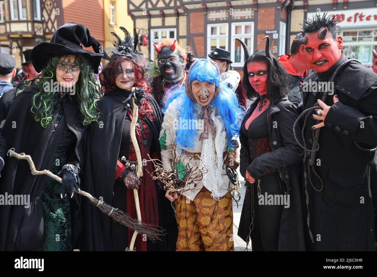 30 April 2022, Saxony-Anhalt, Wernigerode: Women and men in witch and devil costumes stand on the market square. On Walpurgis Day, people in witches' and devils' costumes have traditionally come together to storm the town hall in Wernigerode. In the whole resin, in addition, in other regions and er night to 1. May the traditional Walpurgisfest is celebrated. The strongholds include Thale and Schierke am Brocken. Photo: Matthias Bein/dpa Stock Photo