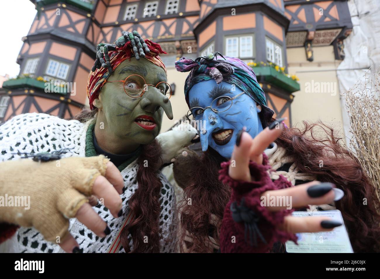 30 April 2022, Saxony-Anhalt, Wernigerode: A man and a woman in witch costume stand in front of the town hall. On Walpurgis Day, people in witches' and devils' costumes have traditionally come together to storm the town hall in Wernigerode. In the whole resin, in addition, in other regions and er night to 1. May the traditional Walpurgisfest is celebrated. The strongholds include Thale and Schierke am Brocken. Photo: Matthias Bein/dpa Stock Photo