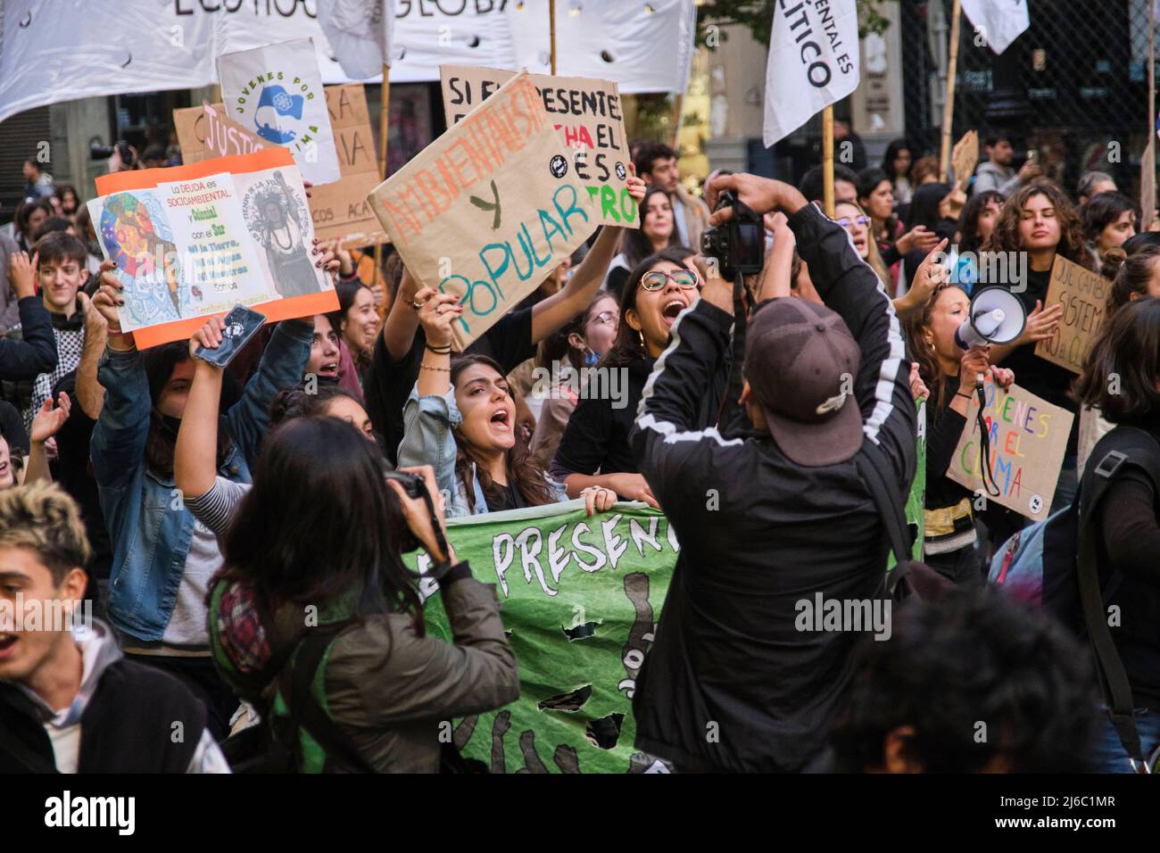 Buenos Aires, Argentina; April 22, 2022: Earth Day demonstration. People marching, shouting and chanting, holding signs with messages of popular envir Stock Photo