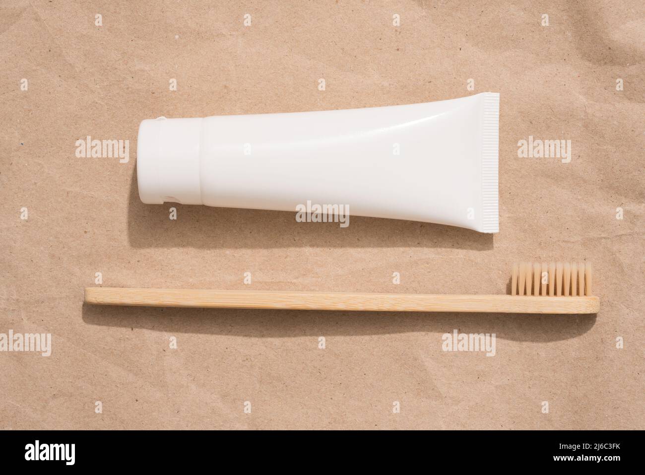 Wooden bamboo toothbrush and tube with organic mineral toothpaste on ...