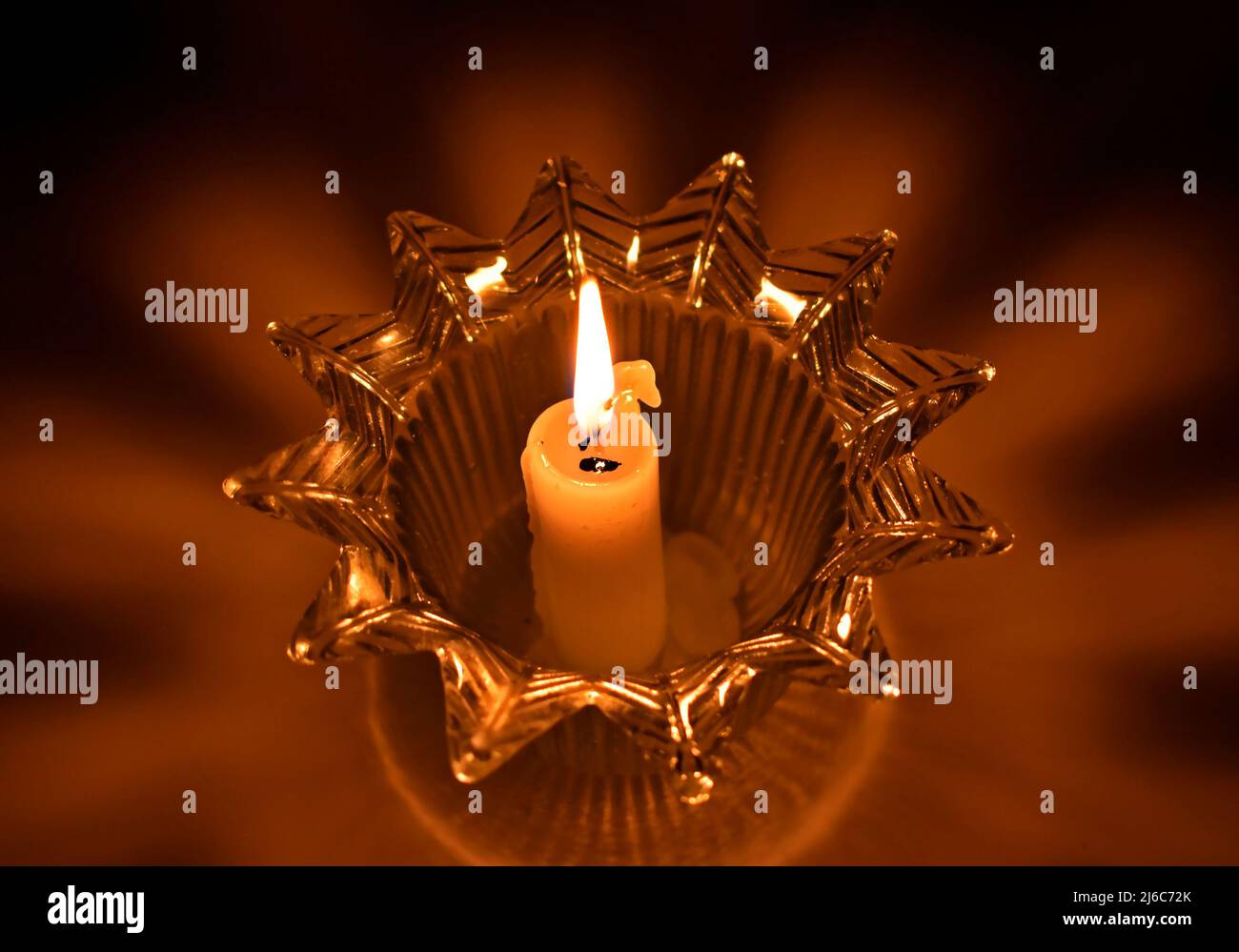 Candle in candlestick, shadows and lights Stock Photo Alamy