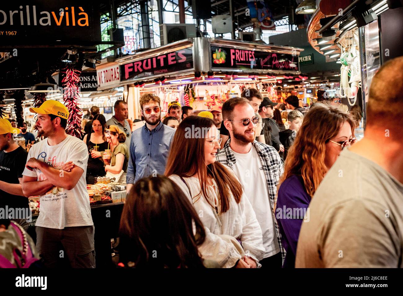 Barcelona, Spain. April 30, 2022.  Tourists and visitors crowd La Boqueria Market in Barcelona. After two years of pandemic and with the end of all restrictions, mass tourism is back to the Mediterranean city of Barcelona, opposition forces in the Barcelona City Council are asking for measures to alleviate the effect of tourist overcrowding on some neighborhoods of the city. Credit:  Jordi Boixareu/Alamy Live News Stock Photo
