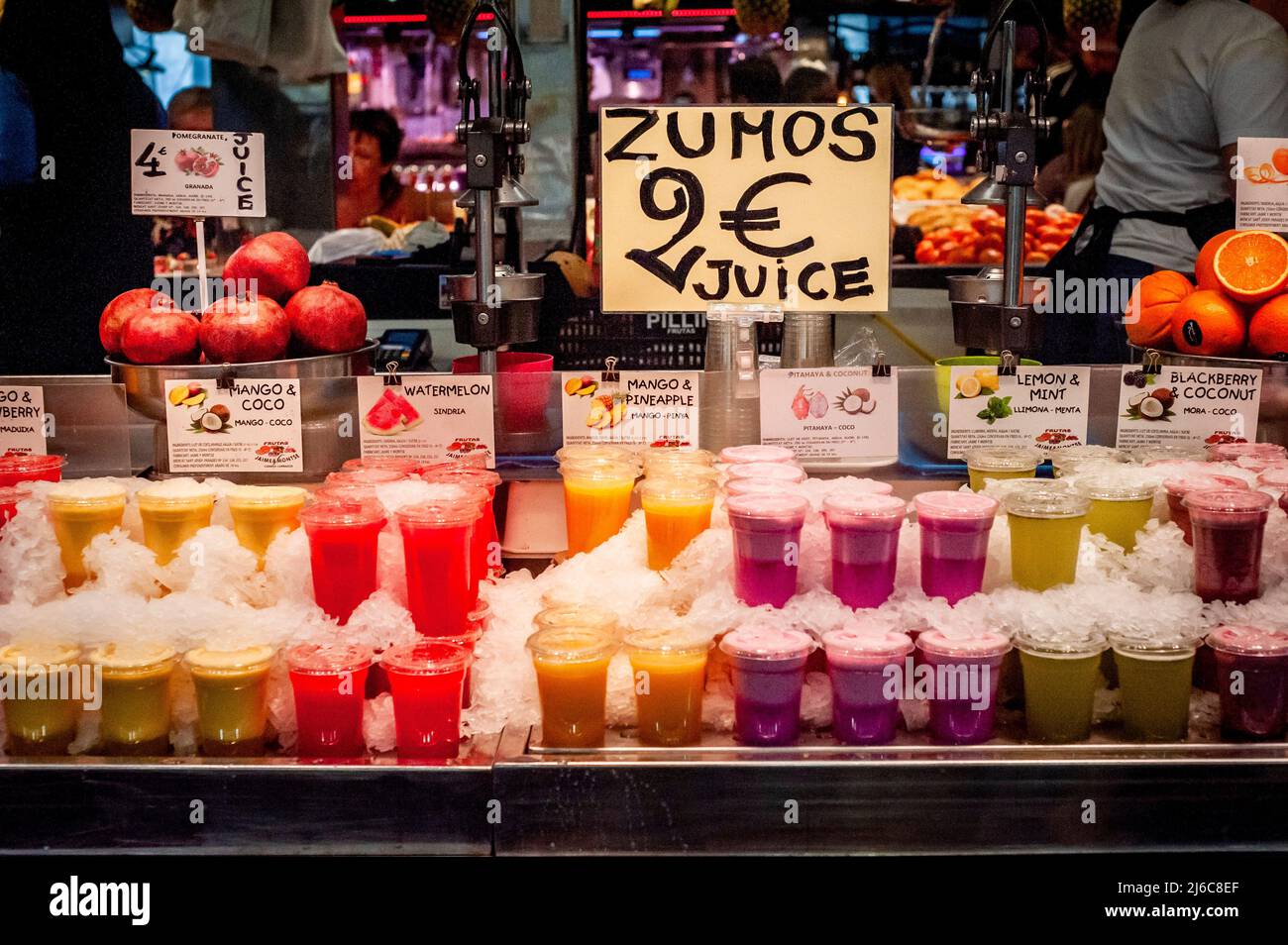 Barcelona, Spain. April 30, 2022.  Fresh juices ready to take away displayed in a stall of Barcelona's La Boqueria market. After two years of pandemic and with the end of all restrictions, mass tourism is back to the Mediterranean city of Barcelona, opposition forces in the Barcelona City Council are asking for measures to alleviate the effect of tourist overcrowding on some neighborhoods of the city. Credit:  Jordi Boixareu/Alamy Live News Stock Photo