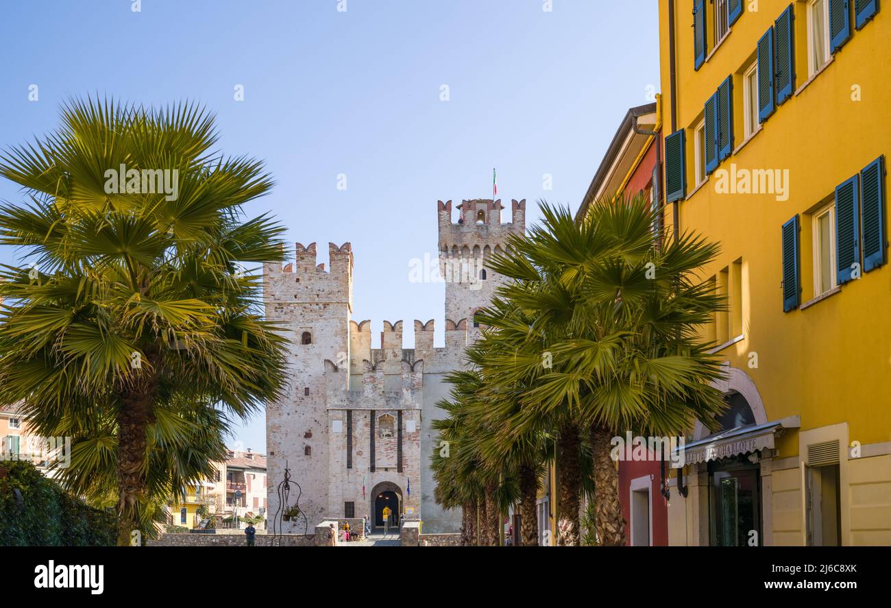 Sirmione, Italy -  March 9, 2022: The  main gate of the Scaliger Castle seen from the old town Stock Photo