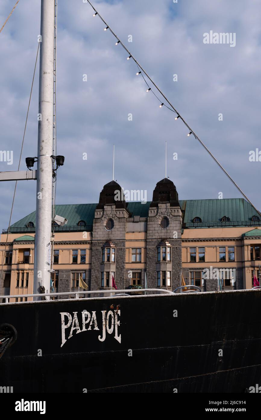 Turku, Finland. August 22, 2021. Papa Joe, Restaurant ship on Aura River, Turku, Finland. With historic building in the background. Stock Photo