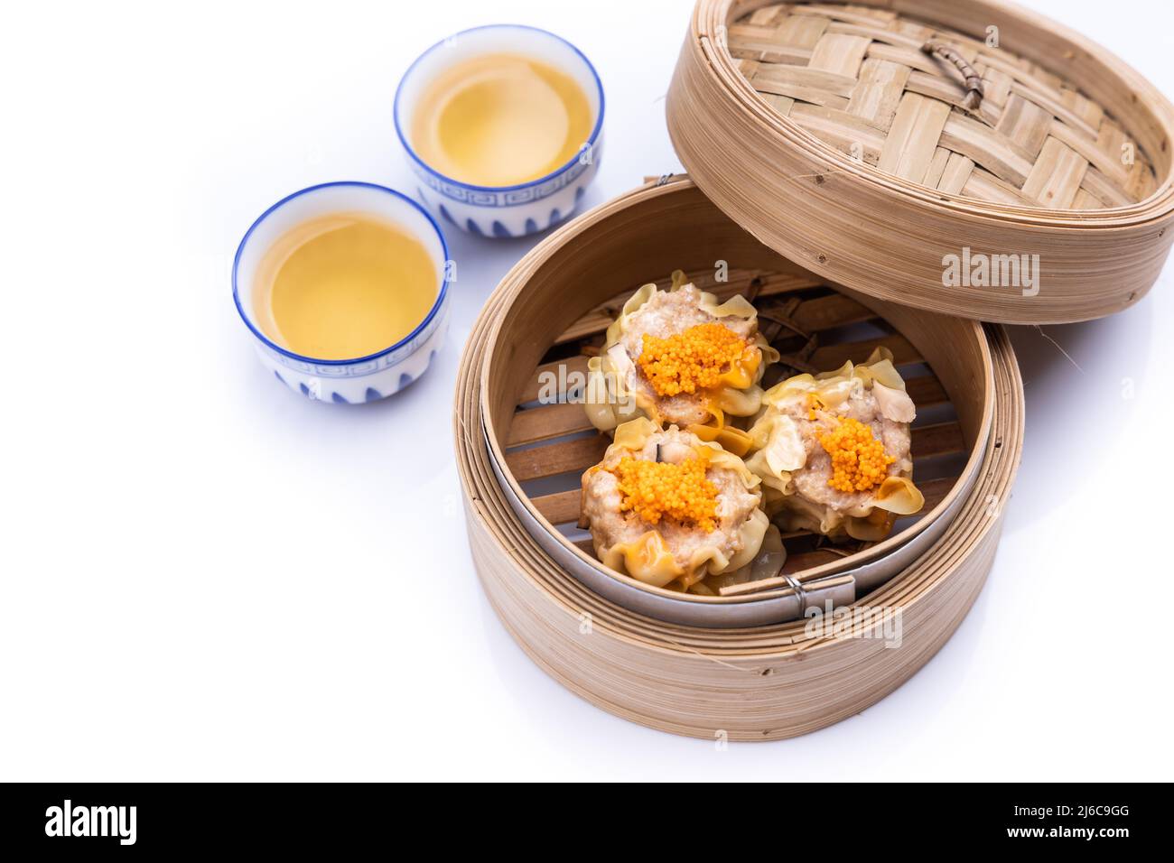 Freshly steamed siew mai or shaomai is poular Cantonese Chinese dim sum delicacy Stock Photo