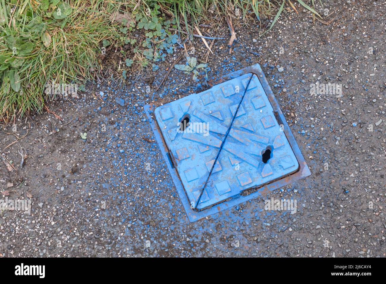 Metal Cover Of Pavement Water Stop Cock Sprayed Blue For Water 