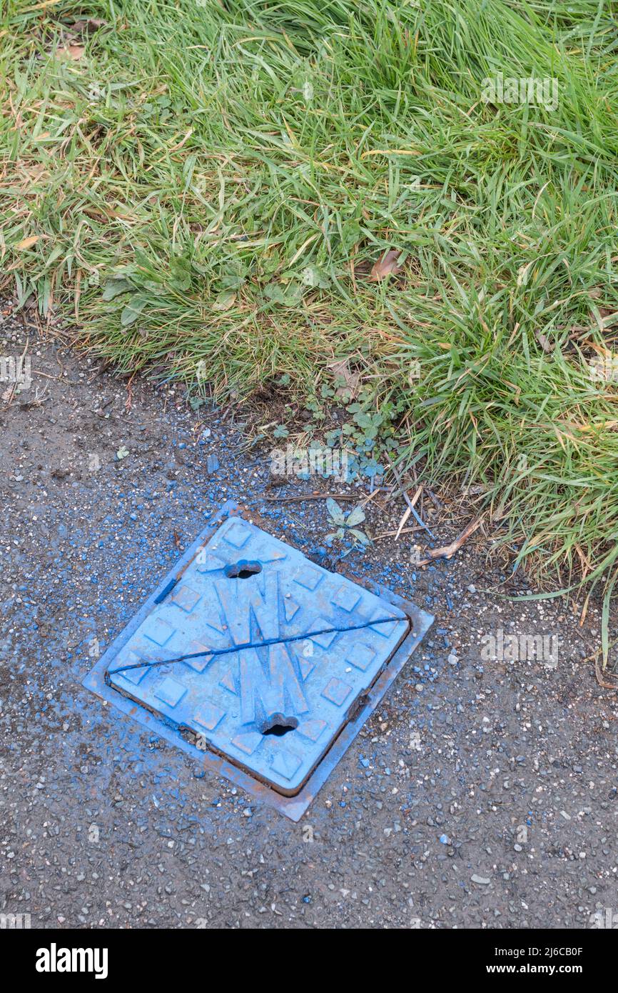Metal Cover Of Pavement Water Stop Cock Sprayed Blue For Water 