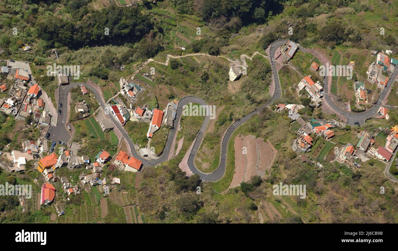 Aerial view of a road and houses in the mountainous village of Curral das Freiras, Madeira, Portugal.  As seen from the mountainside. Stock Photo
