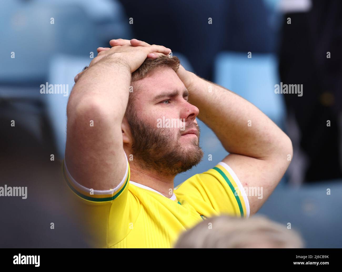 Birmingham, England, 30th April 2022.   Dejected Norwich City fan following their relegation from the premier league during the Premier League match at Villa Park, Birmingham. Picture credit should read: Darren Staples / Sportimage Credit: Sportimage/Alamy Live News Stock Photo