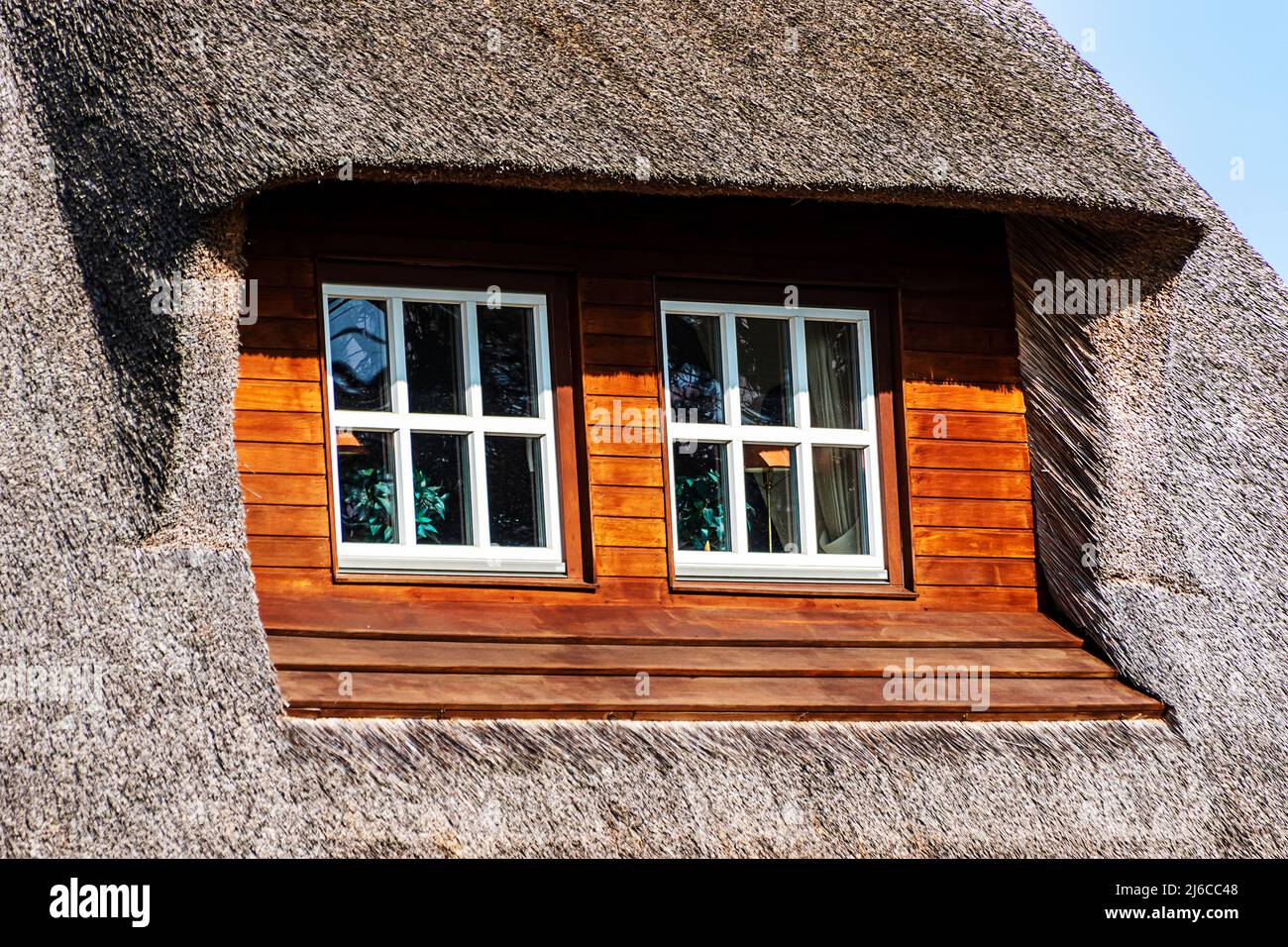 A traditional thatched roof house on the island of Sylt, North Frisian Islands, Germany Stock Photo