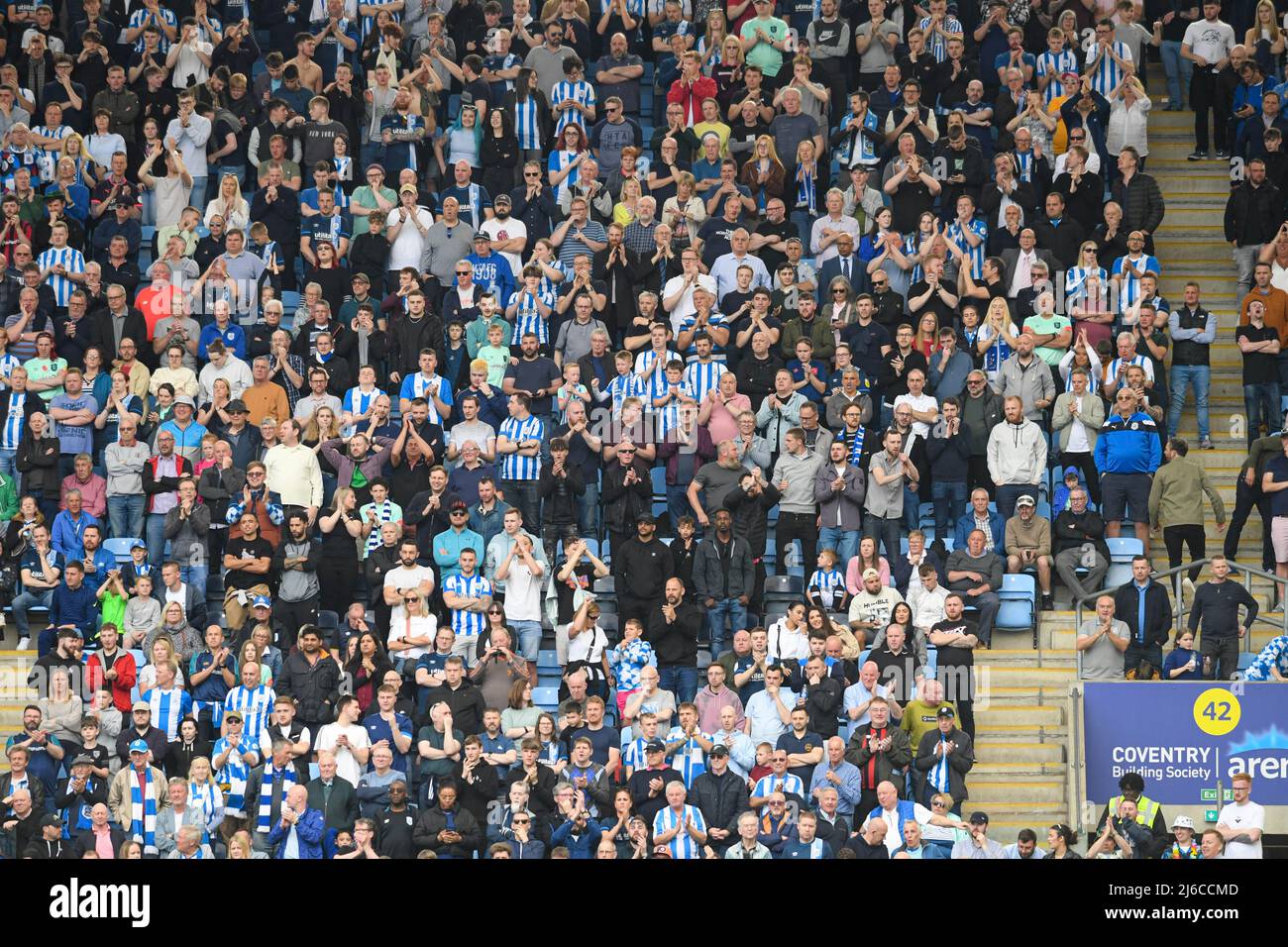 The Huddersfield Town fans enjoy the game at Coventry City Stock Photo